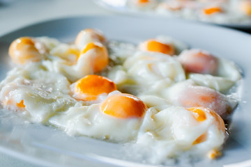 Closeup of many boiled eggs Placed in a dish ready to eat