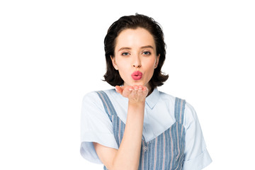 beautiful girl blowing kiss to camera isolated on white