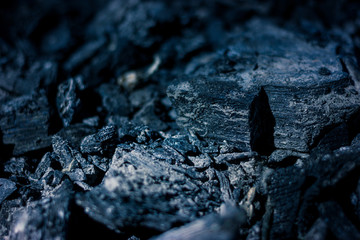Coals of a burnt fire. Coals of a burned bonfire close-up abstract background