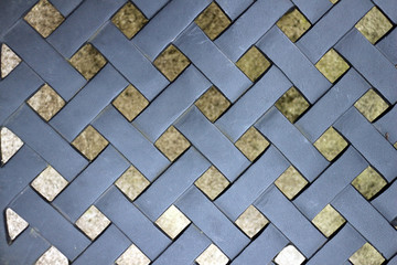 Criss cross pattern. A lattice pattern on a black metal garden chair