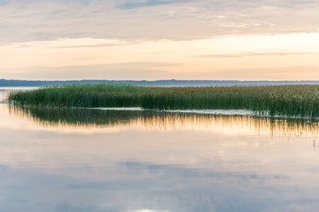 A Still Lake in Rural Latvia at Sunset