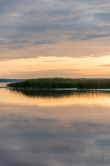 A Still Lake in Rural Latvia at Sunset