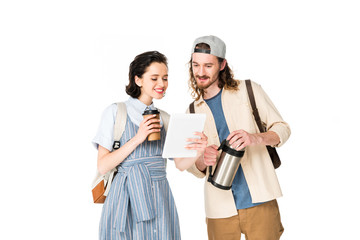 young man and girl looking at device, holding paper cup of coffee and thermos isolated on white