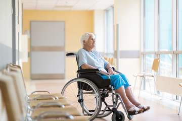 Portrait of an elderly woman sitting in her wheelchair