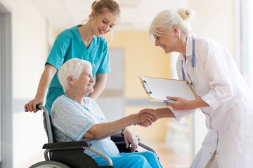 Doctor talking to her patient in hospital