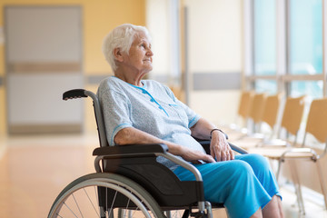 Portrait of an elderly woman sitting in her wheelchair