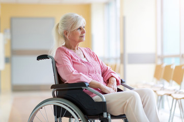 Senior woman sitting in her wheelchair in hospital
