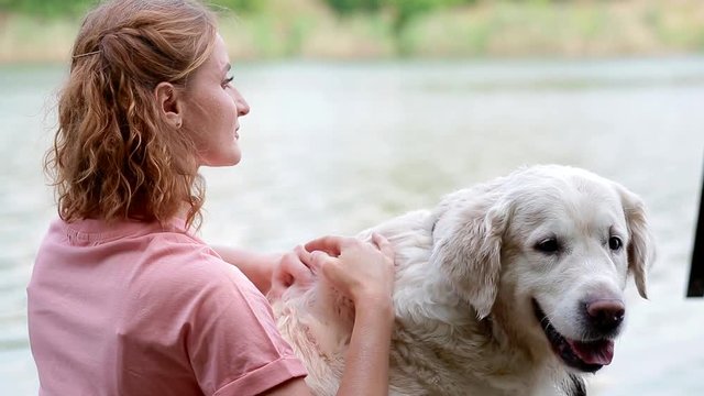 Woman pey her labrador