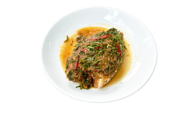 batter fried mango fish dressing spicy herb sauce on plate