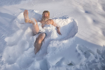 Bearded man, after bathing in the snow