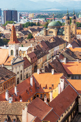 Sibiu, Romania elevated cityscape with Holy Trinity Cathedral and the Reformed Church seen from the steeple of the Lutheran Cathedral of Saint Mary