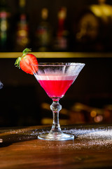 Margarita Strawberry. Alcoholic cocktail. On a wooden background. Top view. Free copy space.