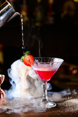 Barman preparing strawberry margarita