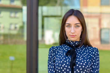 Serious demure stylish young woman