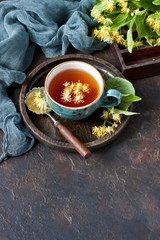 Mug  of herbal tea with linden flowers