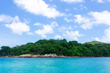 Fototapeta na wymiar Island in the blue sea and blue sky and clouds