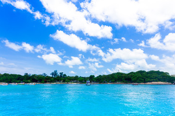 Island in the blue sea and blue sky and clouds