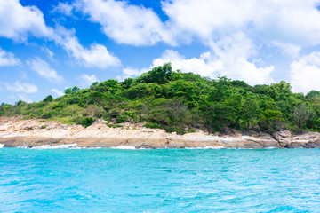 Island in the blue sea and blue sky and clouds