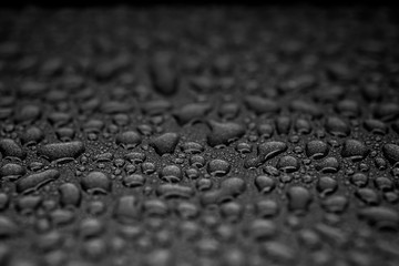 Many abstract liquid droplets on a black background