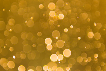 abstract gold background with soft blur bokeh light effect, background bokeh