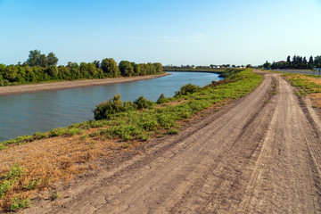 Fototapeta na wymiar Dirt road along the river