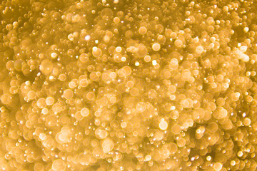 abstract gold background with soft blur bokeh light effect, background bokeh