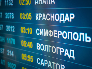 Electronic scoreboard flights and airlines. Destinations wrote in Russian language translate are:...
