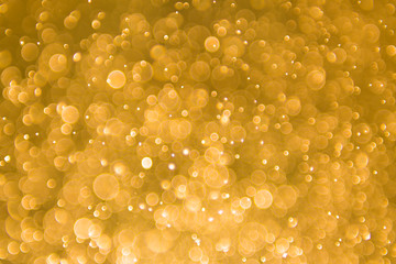 abstract gold background with soft blur bokeh light effect, background bokeh