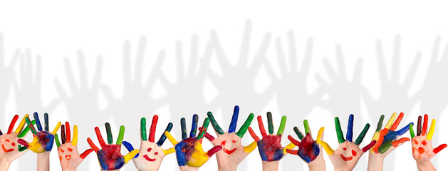 Children's smiling colorful hands raised up. The concept of classroom or back to school