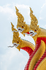Fototapeta na wymiar Golden serpent sculpture in the traditional Thai style.
