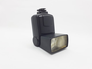 Professional photo camera flash light isolated on white background