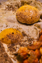 Fried egg with bread and baked white beans in tomato sauce, food