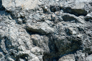 Baikal marble. Baikal stones. The texture of the stone. The texture of marble. The stone walls. The mountain cliffs.