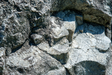 Baikal marble. Baikal stones. The texture of the stone. The texture of marble. The stone walls. The mountain cliffs.