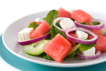 Watermelon salad with feta cheese isolated on white background. Close up