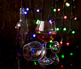 two glasses of wine and lights on background
