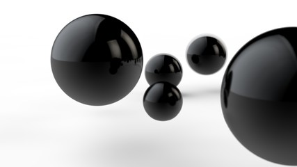 3D illustration of large and small black balls, spheres, geometric shapes isolated on a white background. Abstract, futuristic, cropped image of perfectly shaped objects. 3D rendering