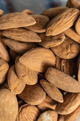 Brown raw almonds pile closeup - Image