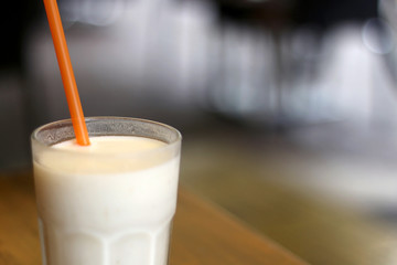 Glass of lassi, traditional Indian drink with yogurt, water and spices. Selective focus.