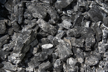 black texture of coals from a barbecue background