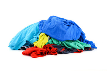 Pile of colorful dirty cloths for laundry isolated on white background