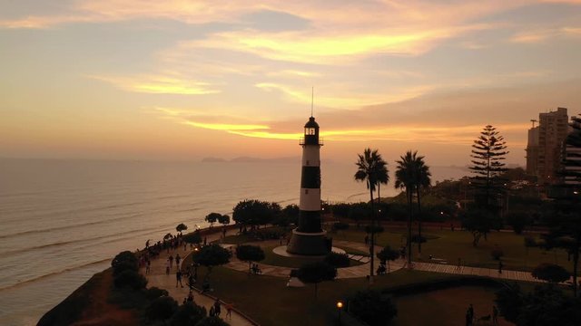 Pullback drone view of Miraflores lighthouse, in Lima, Peru