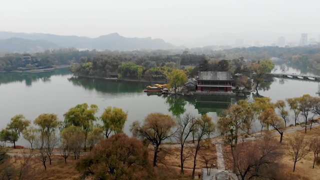 Aerial view little pavilions next the lake inside the Imperial Summer Palace of The Mountain Resort in Chengde. China. Chinese ancient building with lake and old style boat. UNESCO World Heritage.