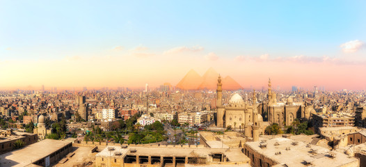Sights of Cairo panorama: the Mosque-Madrassa of Sultan Hassan, the city view and the Pyramids - obrazy, fototapety, plakaty