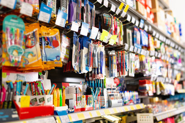 Fototapeta na wymiar Colorful pen shelves in office supply store