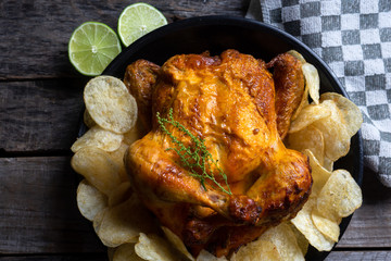Tasty roasted chicken with potato chips
