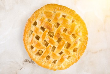 Delicious baked pie, top view on white background