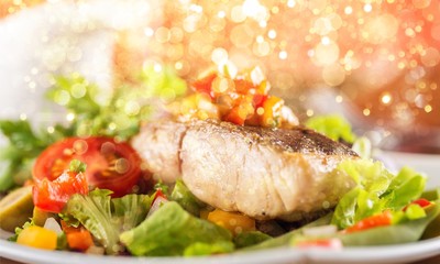 Delicious fried meat with salad on plate, close up