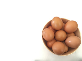 Eggs: brown eggs in separate cups on a white background in close-up shot from top to bottom Thailand