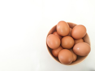 Eggs: brown eggs in separate cups on a white background in close-up shot from top to bottom Thailand